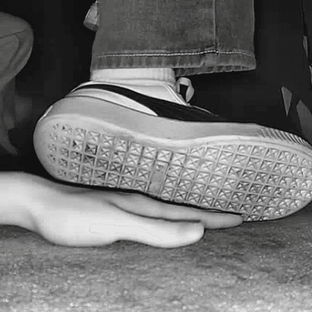 Woman candid hand trample with white socks and Puma sneakers in cinema 3