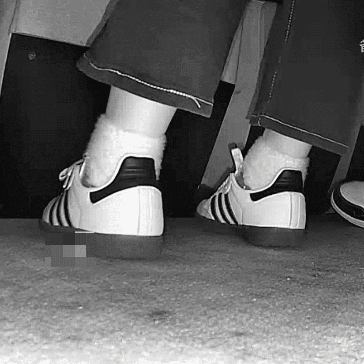 Woman candid crushing with Adidas Samba shoes in cinema thumb 3