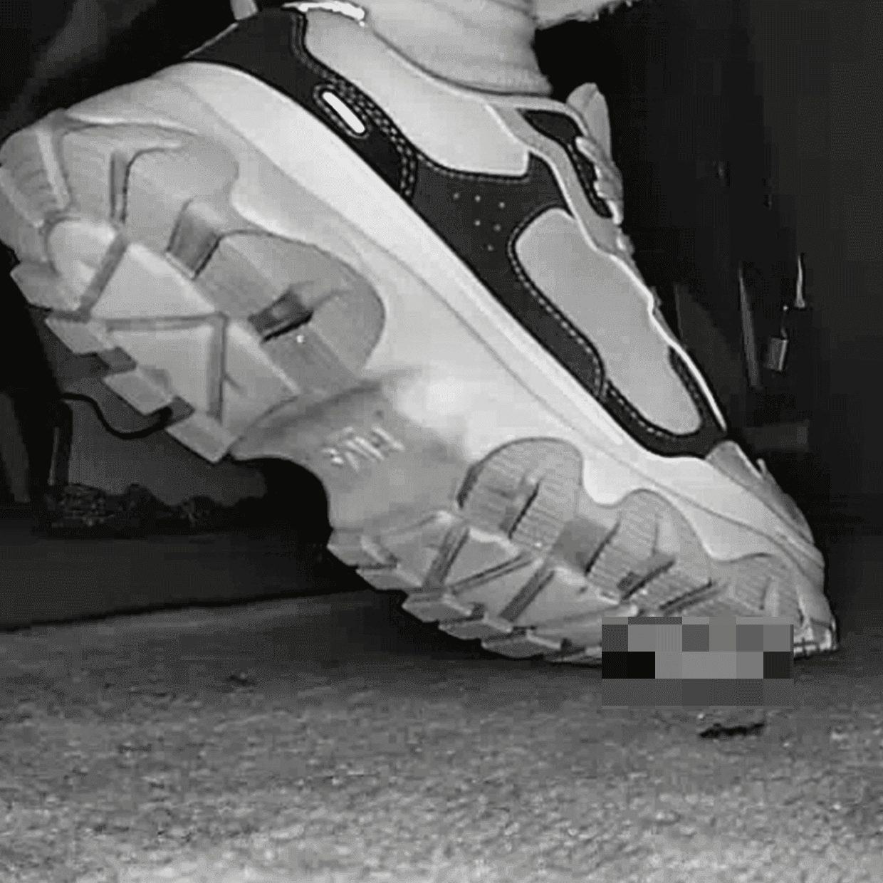 Woman in Fila sneaker candid crushing in cinema