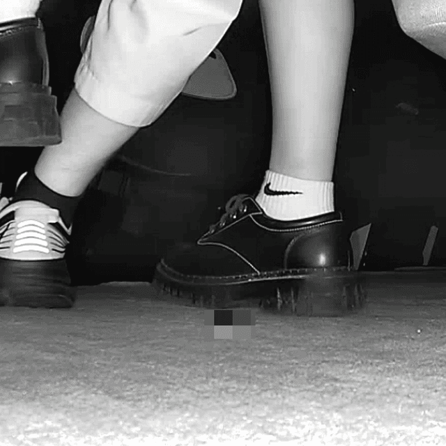 Woman in white socks and leather shoes with her boyfriend candid crushing at the cinema 4