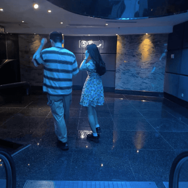 Woman in white socks and leather shoes with her boyfriend candid crushing at the cinema 5