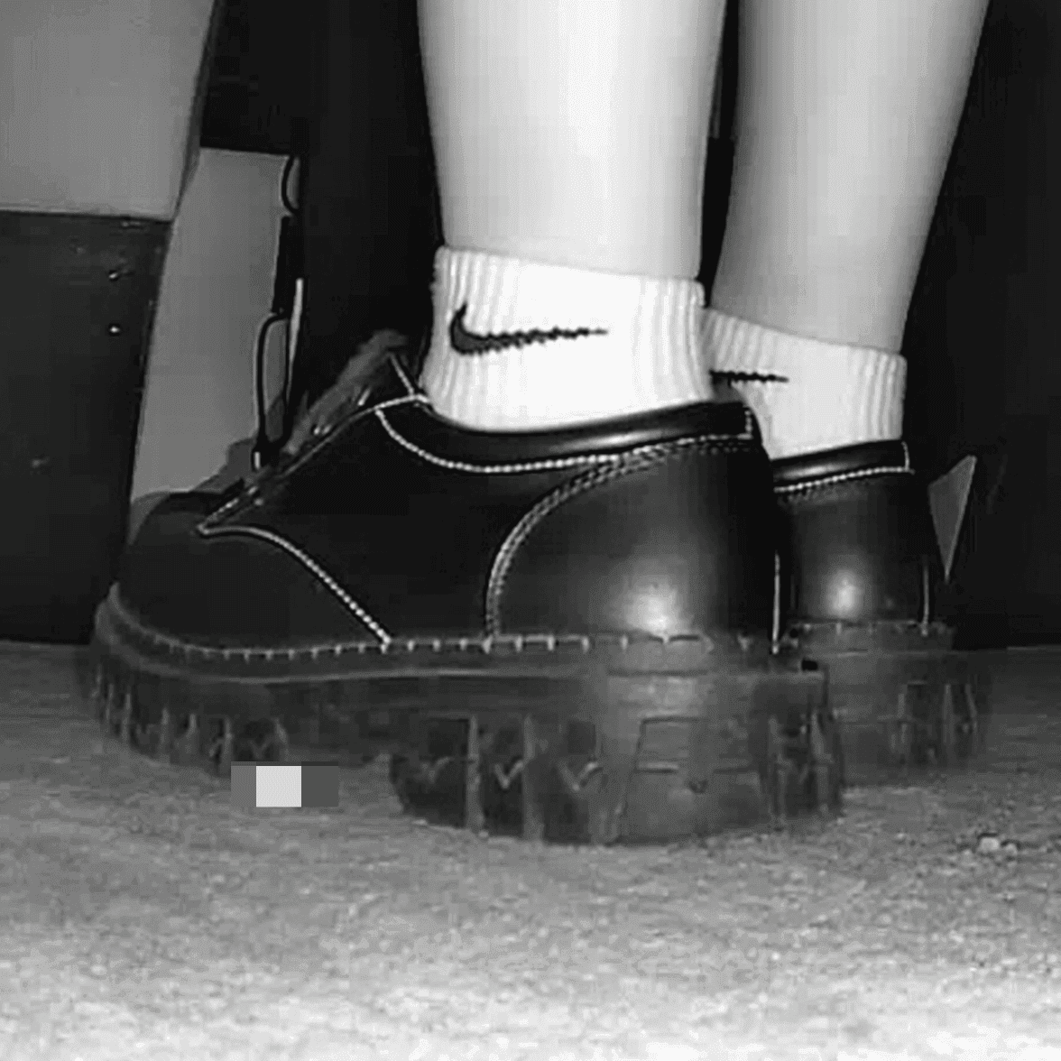 Woman in white socks and leather shoes with her boyfriend candid crushing at the cinema