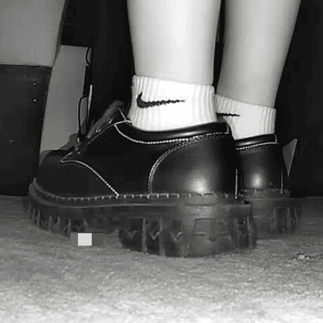 Woman in white socks and leather shoes with her boyfriend candid crushing at the cinema 1