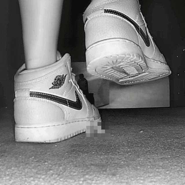 Woman candid crush with Air Force 1 sneakers in cinema 2
