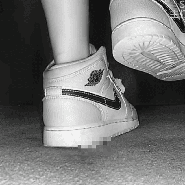 Woman candid crush with Air Force 1 sneakers in cinema 3