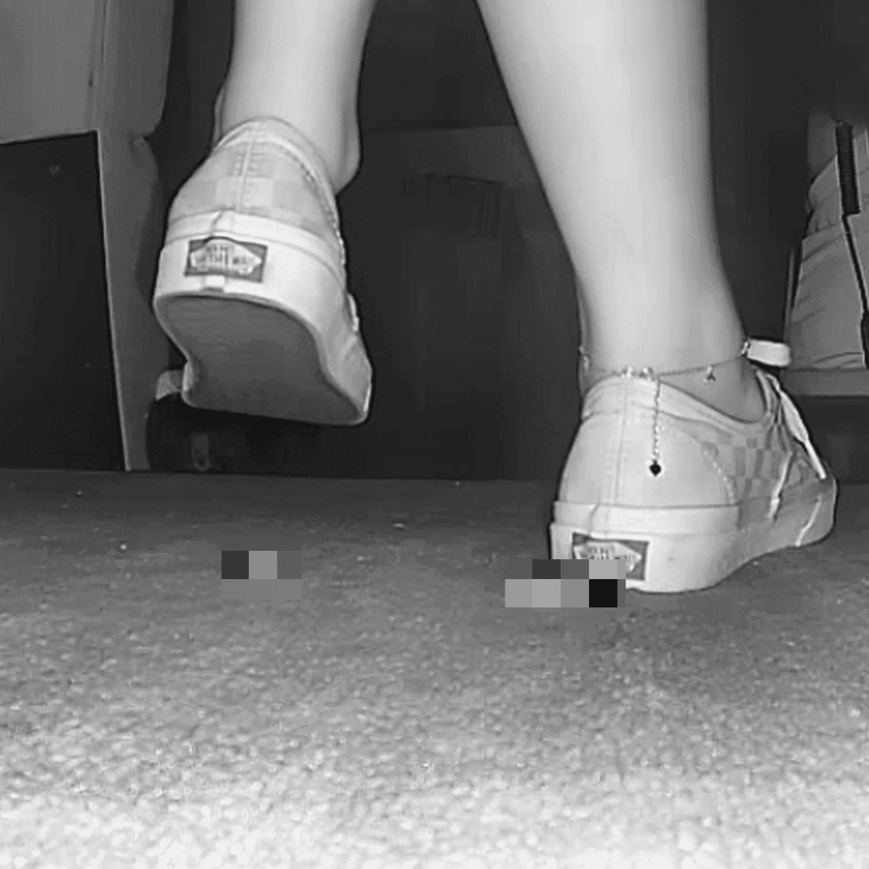 Woman in long skirt and Vans shoes candid crushing at the cinema
