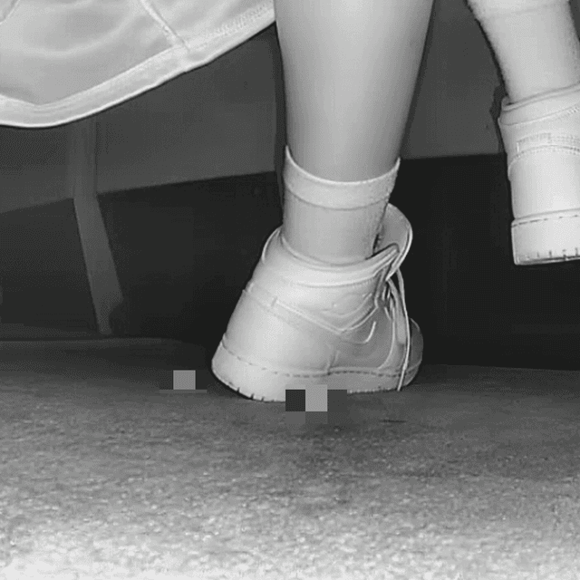 Woman at the cinema with white high-top Nike Air Jordan sneakers candid crushing 3