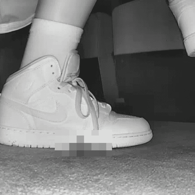 Woman at the cinema with white high-top Nike Air Jordan sneakers candid crushing 4