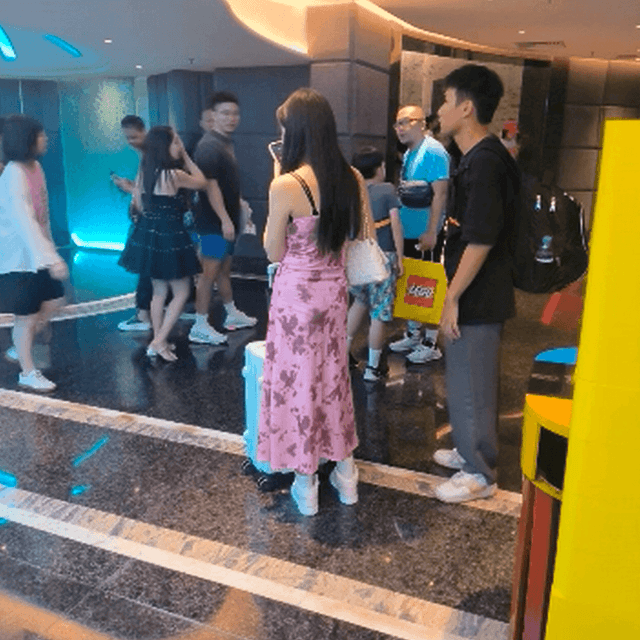 Woman at the cinema with white high-top Nike Air Jordan sneakers candid crushing 5