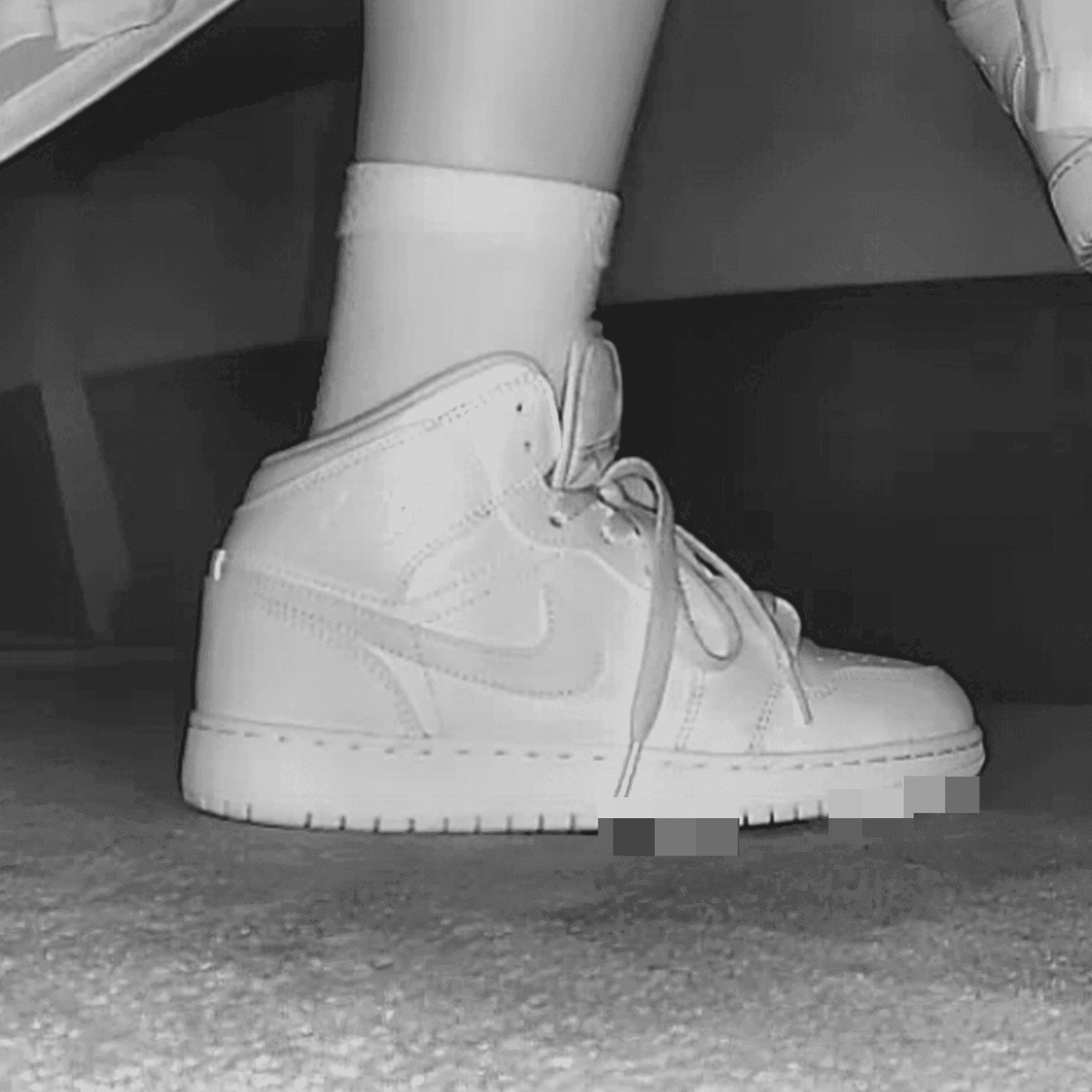 Woman at the cinema with white high-top Nike Air Jordan sneakers candid crushing
