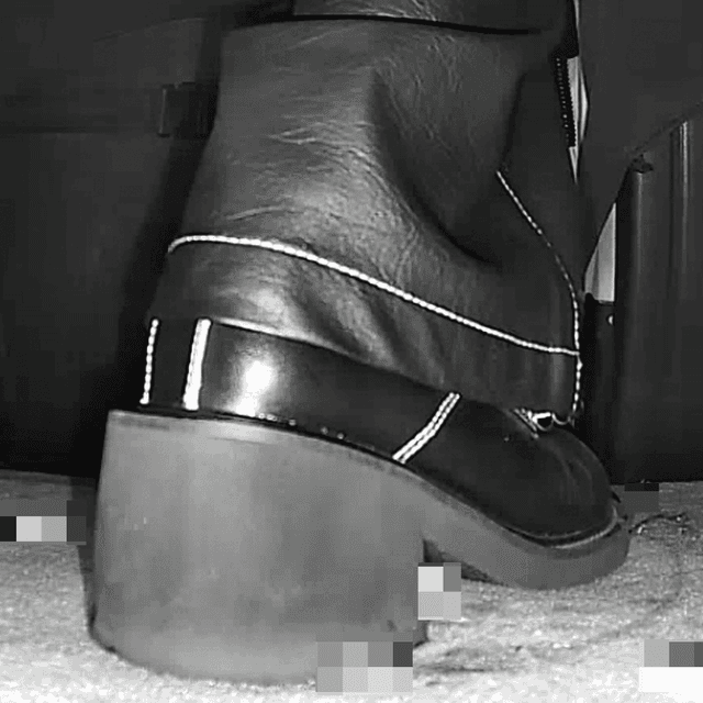 Woman in cinema candid crushing with block-heeled boots 2