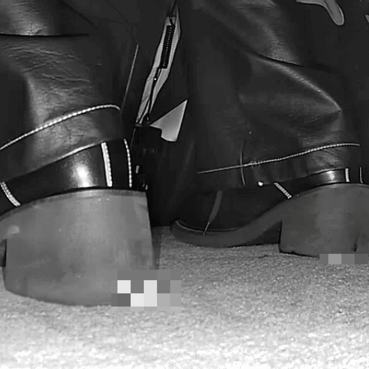 Woman in cinema candid crushing with block-heeled boots