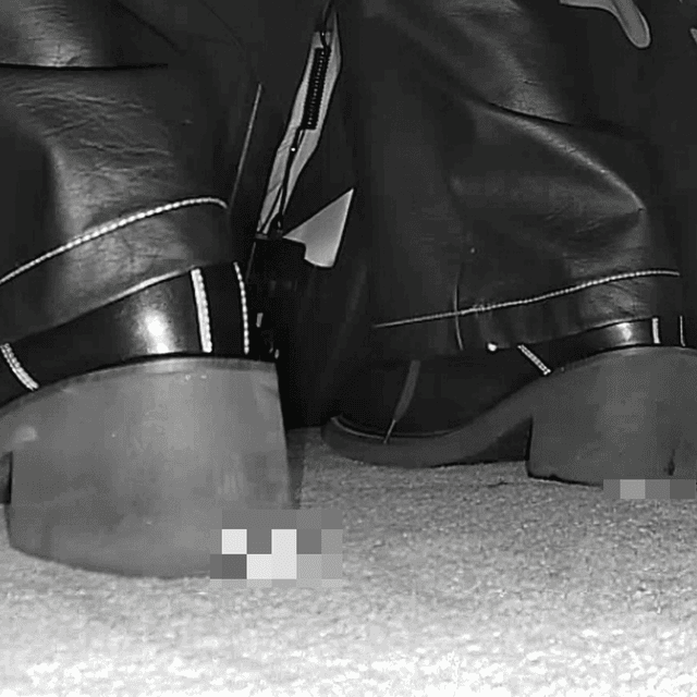 Woman in cinema candid crushing with block-heeled boots 1