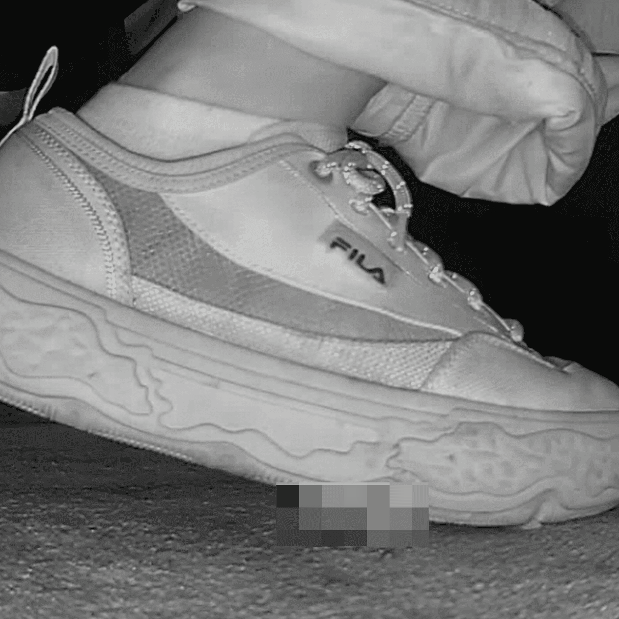 Three women in cinema candid crushing with Fila and Skechers sneakers