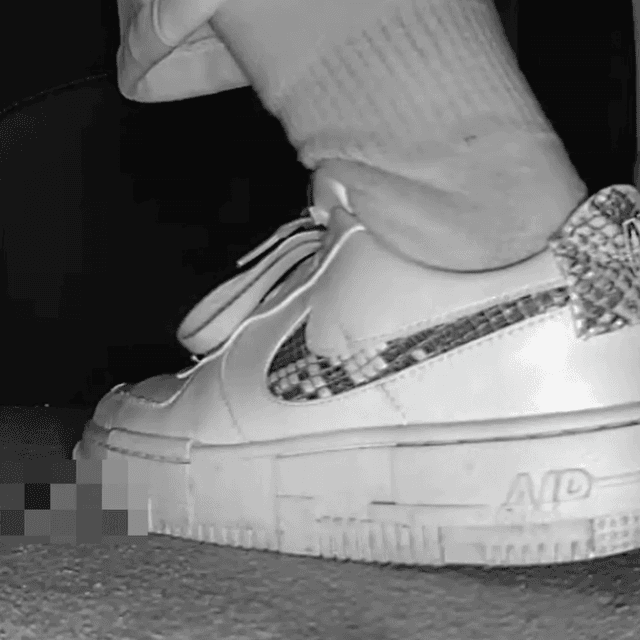 Woman in cinema candid crushing with Nike sneaker 1