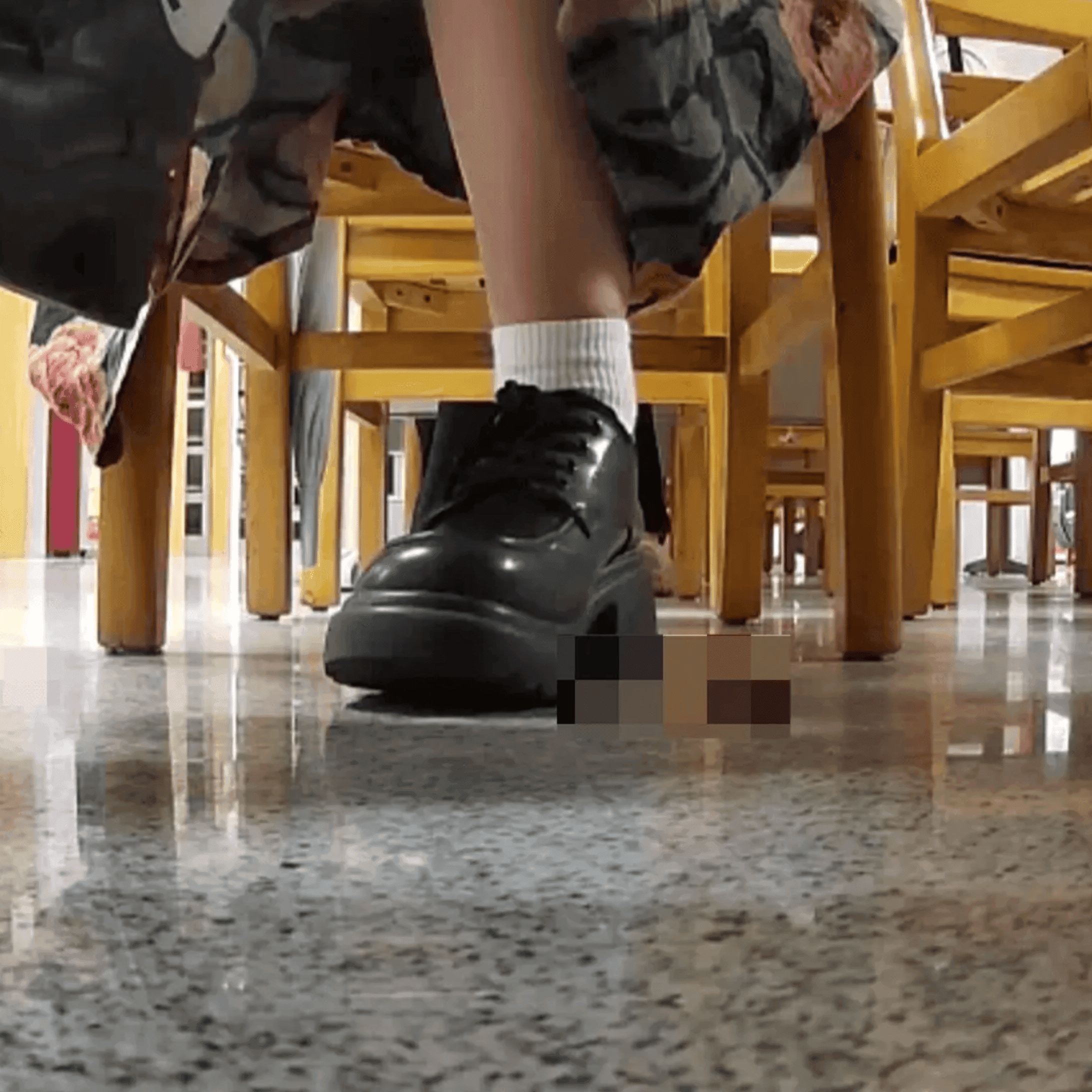Woman in chunky heels candid crushing under the library table
