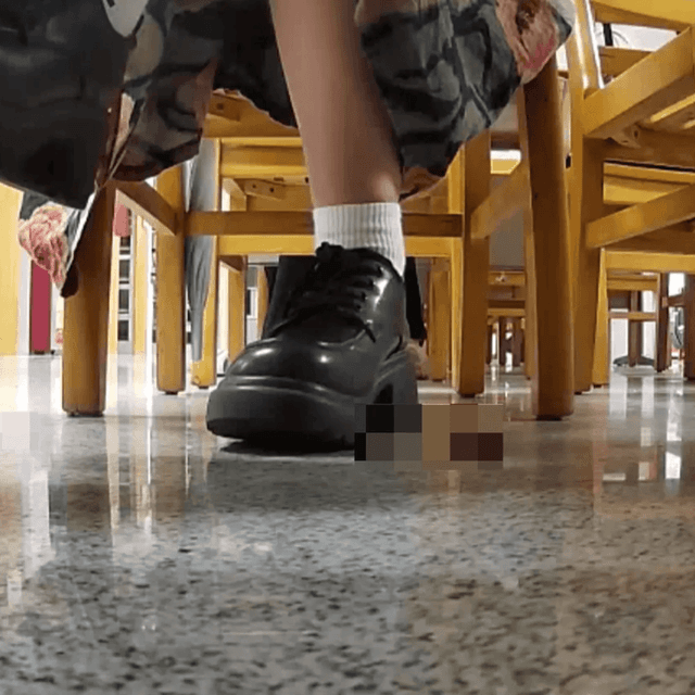 Woman in chunky heels candid crushing under the library table 1